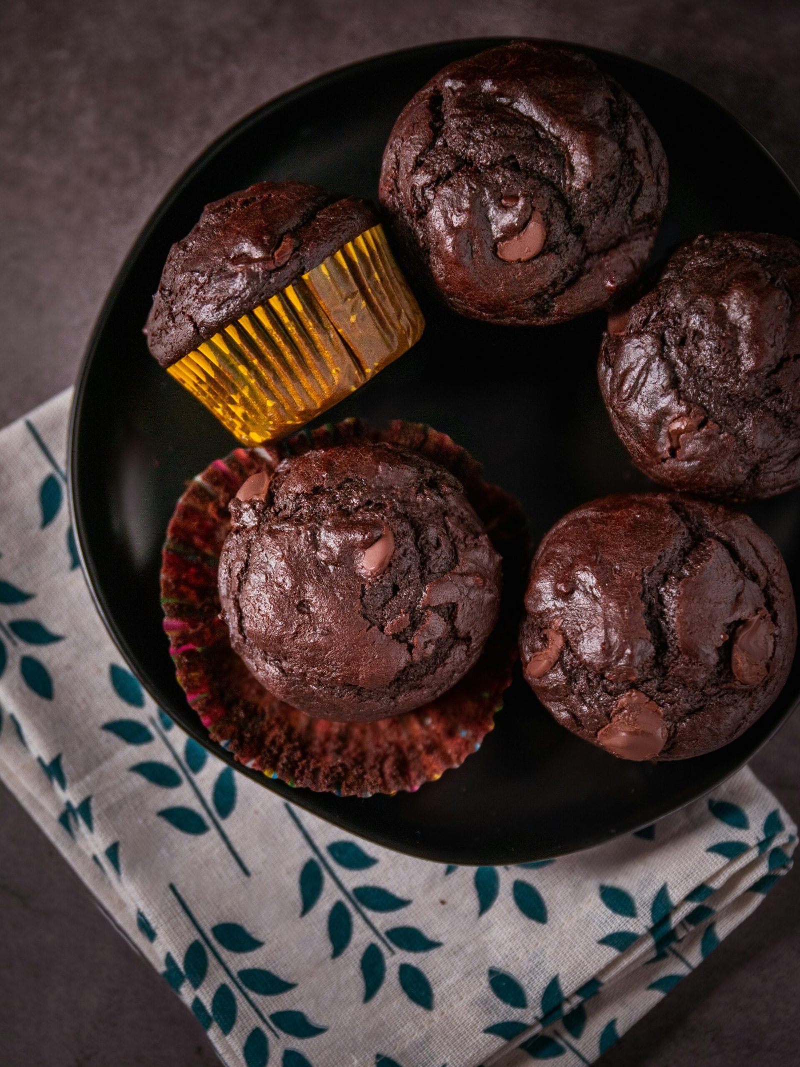 chocolate cupcakes on blue and white ceramic plate